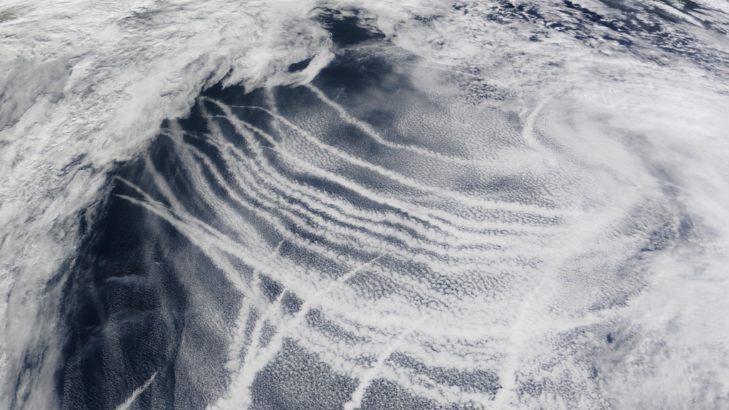 Satellite image of ship tracks — bright cloud trails formed by ship exhaust aerosol over the Pacific Ocean